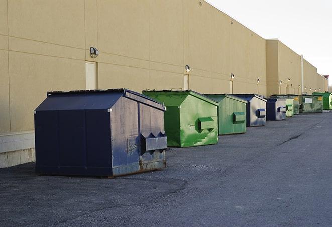 roll-off dumpsters ready for delivery to a construction project in Ackerman